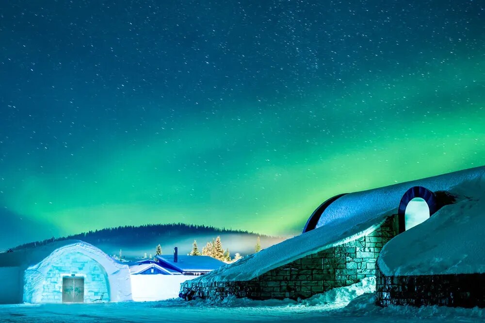 ICEHOTEL snow and ice buildings beneath a winter sky